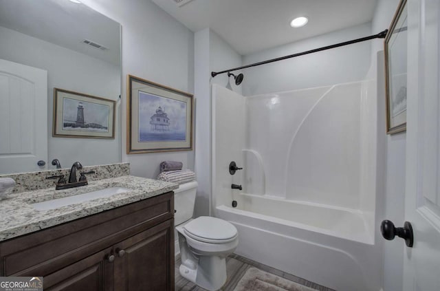 17 Ivy Stone Ct SE, Cartersville, GA 30120 - bathroom with wood finished floors, vanity, washtub / shower combination, toilet, and visible vents