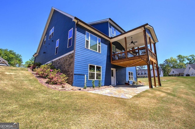 17 Ivy Stone Ct SE, Cartersville, GA 30120 - back of property with stone siding, a ceiling fan, a yard, and a patio