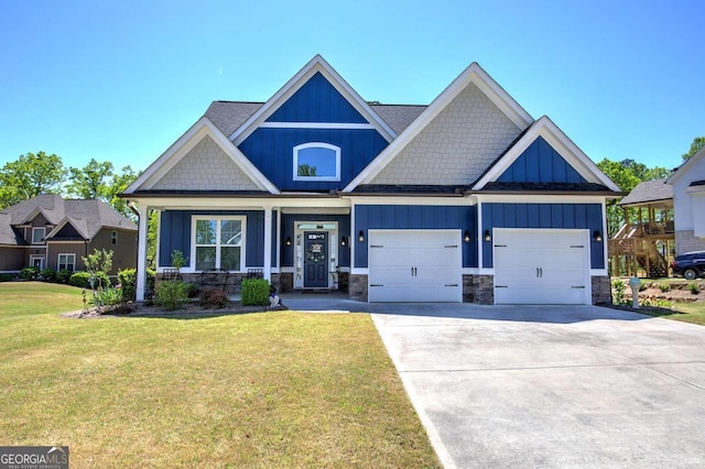 17 Ivy Stone Ct SE, Cartersville, GA 30120 - craftsman inspired home featuring board and batten siding, driveway, stone siding, a front yard, and a garage