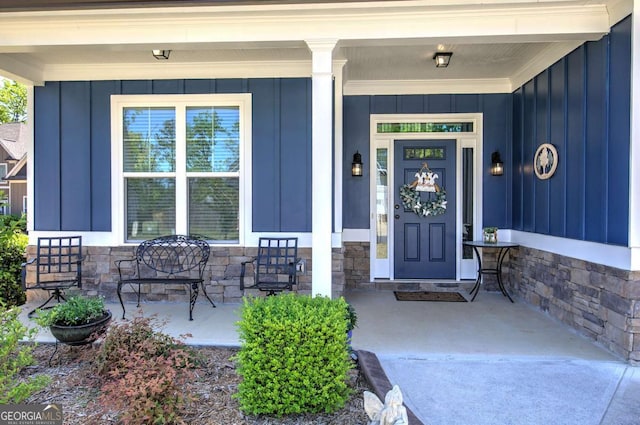 17 Ivy Stone Ct SE, Cartersville, GA 30120 - doorway to property featuring stone siding, board and batten siding, and covered porch