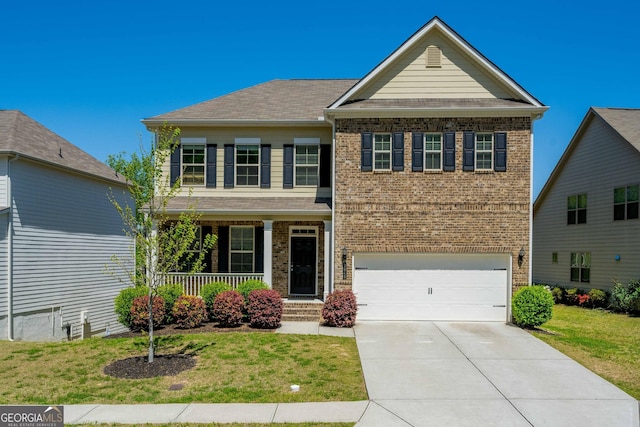 traditional home featuring a front lawn, concrete driveway, covered porch, brick siding, and an attached garage