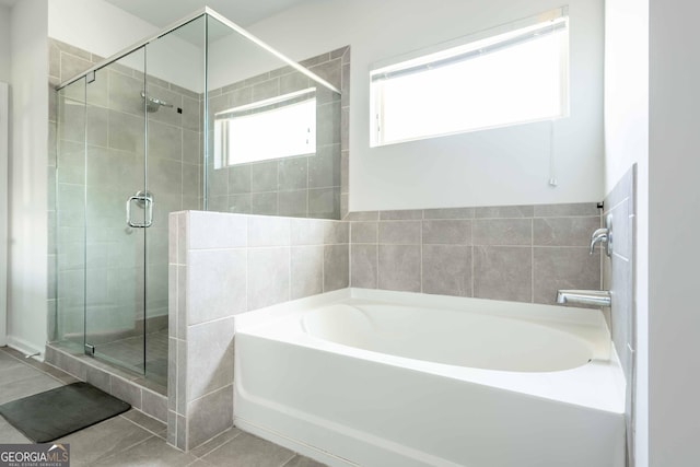 full bath with a shower stall, a garden tub, and tile patterned floors