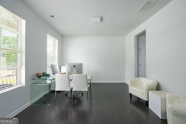 office area featuring baseboards, wood finished floors, and visible vents