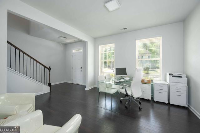 office area featuring baseboards, dark wood-style flooring, and visible vents