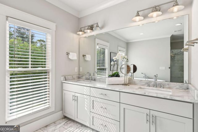 full bath featuring plenty of natural light, marble finish floor, and a sink