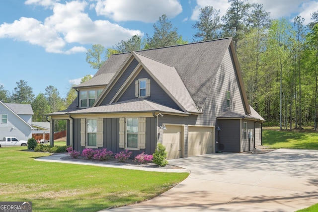 craftsman inspired home with an attached garage, driveway, a front yard, and roof with shingles