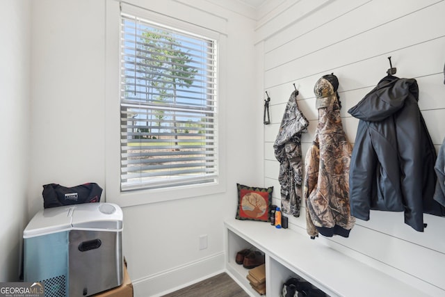 mudroom with baseboards and wood finished floors
