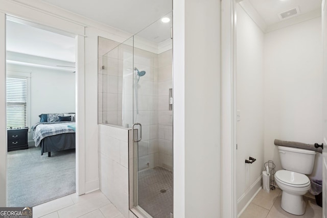 bathroom with tile patterned floors, visible vents, a shower stall, and toilet