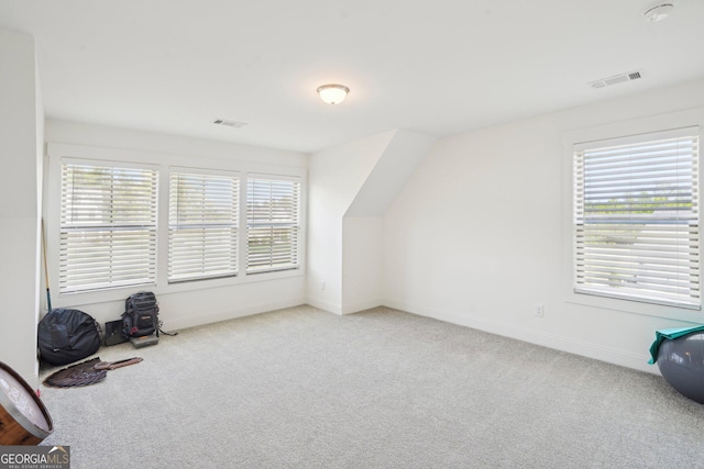 bonus room with carpet floors, visible vents, and baseboards
