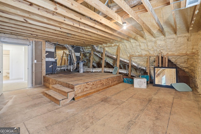 unfinished attic with heating unit