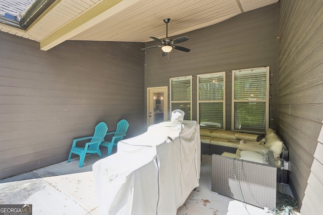 view of patio / terrace with ceiling fan and an outdoor living space