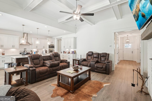 living area with light wood finished floors, recessed lighting, coffered ceiling, beamed ceiling, and ceiling fan
