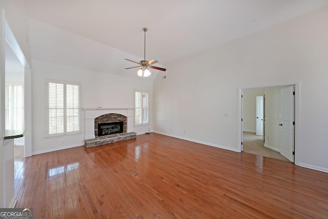 15 Boxelder Ct, Dallas, GA 30132 - unfurnished living room with wood finished floors, a wealth of natural light, a ceiling fan, and high vaulted ceiling