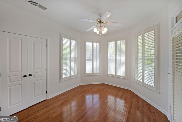 15 Boxelder Ct, Dallas, GA 30132 - interior space featuring hardwood / wood-style floors, plenty of natural light, a ceiling fan, and visible vents