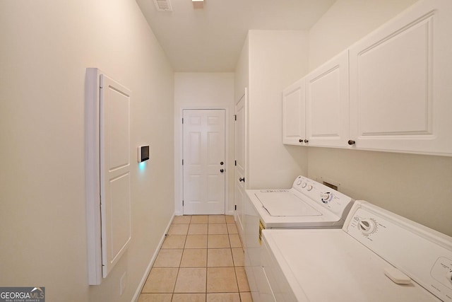 15 Boxelder Ct, Dallas, GA 30132 - clothes washing area featuring washing machine and clothes dryer, baseboards, visible vents, cabinet space, and light tile patterned floors
