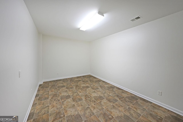15 Boxelder Ct, Dallas, GA 30132 - unfurnished room with baseboards, visible vents, and stone finish floor