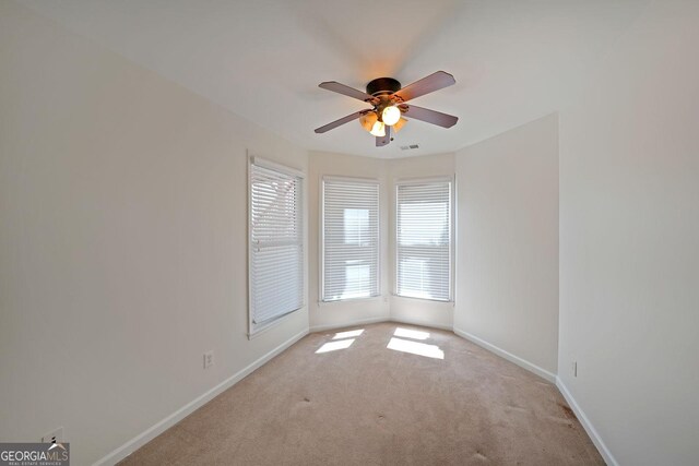 15 Boxelder Ct, Dallas, GA 30132 - carpeted spare room featuring visible vents, baseboards, and ceiling fan