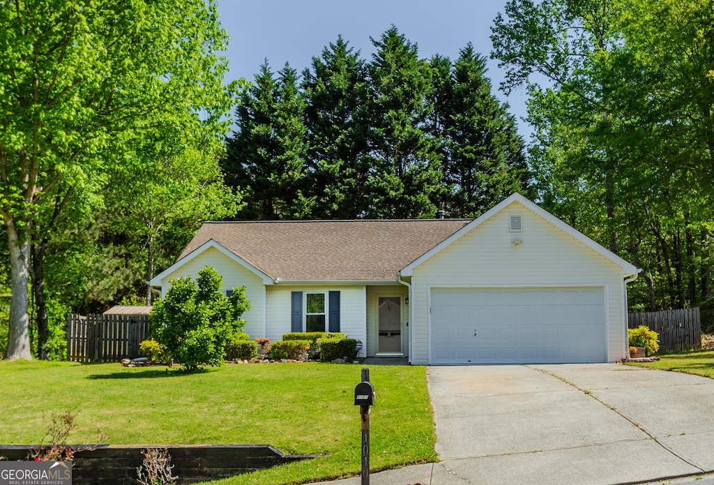 1010 J Dorothy Pl, Sugar Hill, GA 30518 - ranch-style house featuring a garage, driveway, a front lawn, and fence