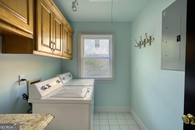 4157 Town Branch Ct SW, Covington, GA 30014 - laundry area with washer and dryer, baseboards, electric panel, cabinet space, and light tile patterned floors