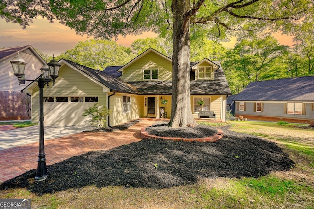 4157 Town Branch Ct SW, Covington, GA 30014 - view of front of home with a porch, a garage, and decorative driveway