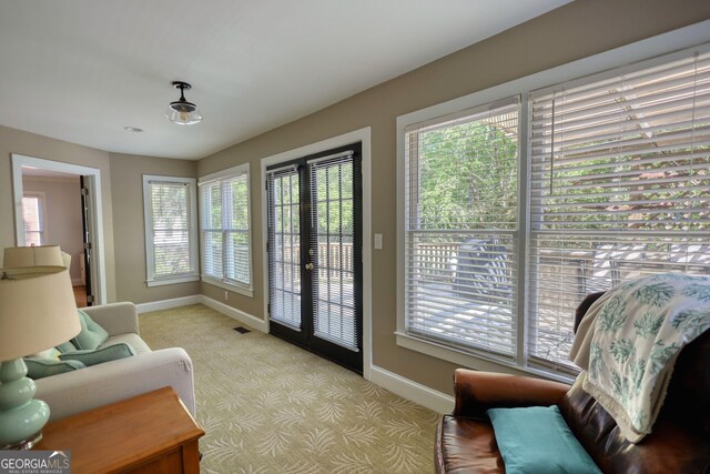 4157 Town Branch Ct SW, Covington, GA 30014 - sitting room featuring carpet floors, baseboards, and a healthy amount of sunlight