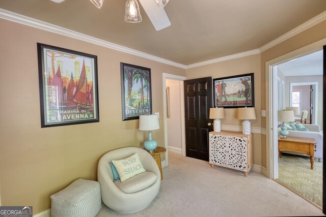 4157 Town Branch Ct SW, Covington, GA 30014 - living area featuring carpet floors, a ceiling fan, baseboards, and crown molding