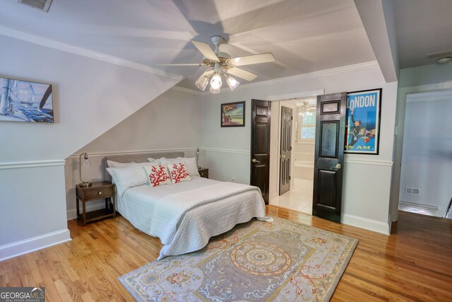 4157 Town Branch Ct SW, Covington, GA 30014 - bedroom featuring ceiling fan, visible vents, crown molding, baseboards, and light wood-style flooring