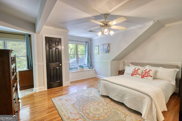 4157 Town Branch Ct SW, Covington, GA 30014 - bedroom with a ceiling fan, baseboards, wood finished floors, visible vents, and ornamental molding