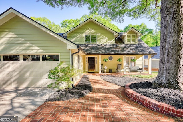 4157 Town Branch Ct SW, Covington, GA 30014 - view of front of house with a garage, a shingled roof, a porch, and driveway