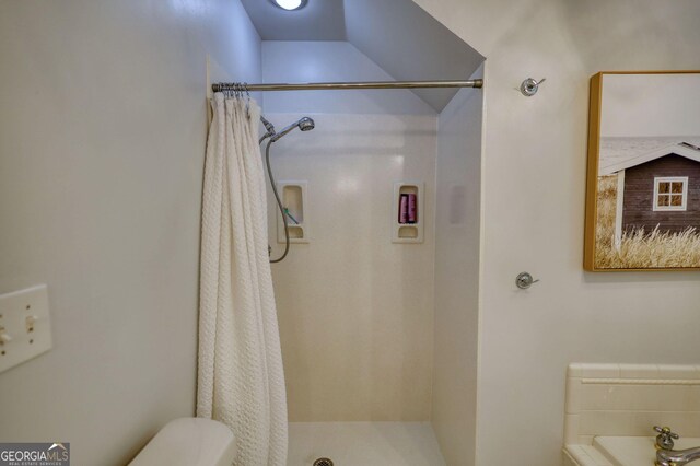 4157 Town Branch Ct SW, Covington, GA 30014 - bathroom featuring a shower with shower curtain and toilet