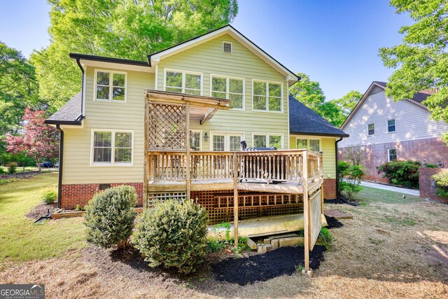 4157 Town Branch Ct SW, Covington, GA 30014 - back of property with roof with shingles, a deck, and crawl space