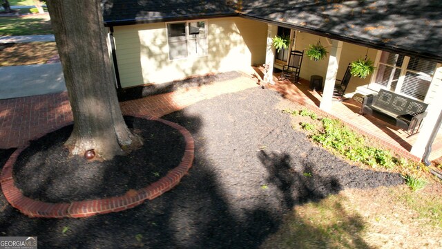 4157 Town Branch Ct SW, Covington, GA 30014 - view of side of property featuring a patio area and roof with shingles