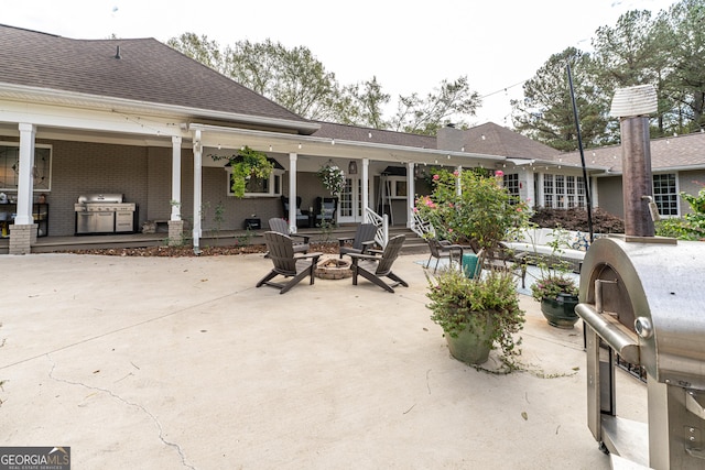 10 Rivermont Dr SW, Rome, GA 30165 - view of patio with a fire pit and a grill