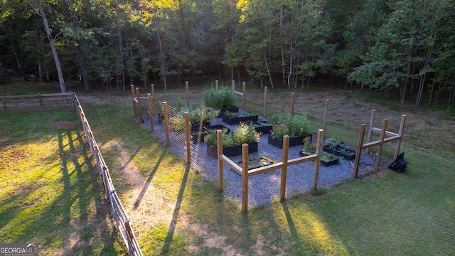 10 Rivermont Dr SW, Rome, GA 30165 - view of yard featuring fence, a vegetable garden, and a view of trees