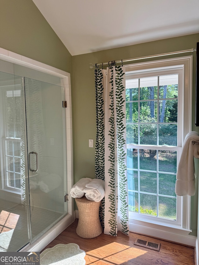 10 Rivermont Dr SW, Rome, GA 30165 - full bath with a shower stall, lofted ceiling, wood finished floors, and visible vents