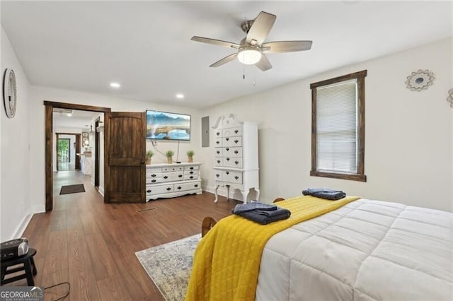 1060 Stephen St, Greensboro, GA 30642 - bedroom featuring dark wood-style flooring, recessed lighting, ceiling fan, and electric panel