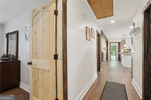 1060 Stephen St, Greensboro, GA 30642 - hallway with attic access and wood finished floors