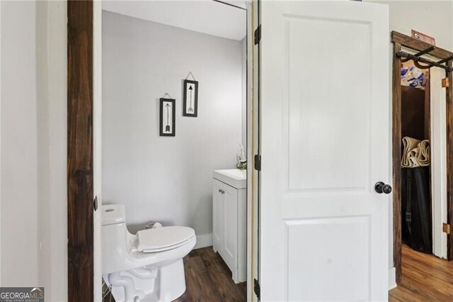 1060 Stephen St, Greensboro, GA 30642 - bathroom with wood finished floors and toilet