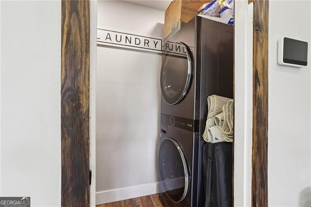 1060 Stephen St, Greensboro, GA 30642 - washroom featuring stacked washer / drying machine and wood finished floors