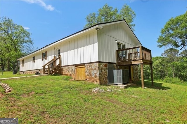 1060 Stephen St, Greensboro, GA 30642 - rear view of property featuring a yard, a wooden deck, and board and batten siding