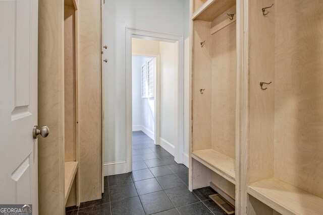 671 Ellison Rd, Tyrone, GA 30290 - mudroom with dark tile patterned flooring and baseboards
