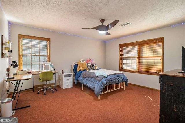 bedroom featuring visible vents, carpet floors, and multiple windows