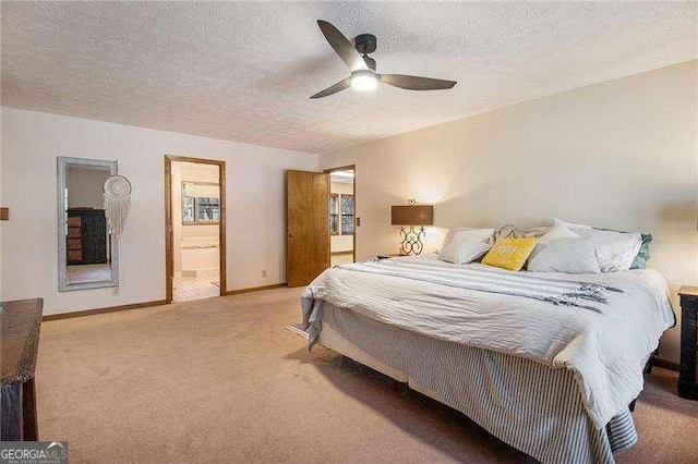 carpeted bedroom featuring connected bathroom, a textured ceiling, ceiling fan, and baseboards
