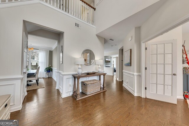 213 Roseman Way, Woodstock, GA 30188 - entryway with a decorative wall, wood finished floors, and wainscoting