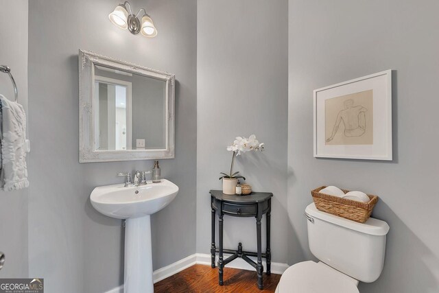 213 Roseman Way, Woodstock, GA 30188 - bathroom with wood finished floors, toilet, baseboards, and a sink