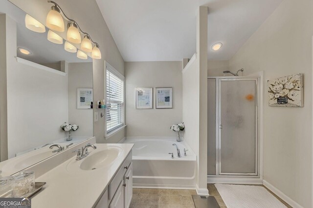 213 Roseman Way, Woodstock, GA 30188 - bathroom with a shower stall, a bath, vanity, baseboards, and vaulted ceiling
