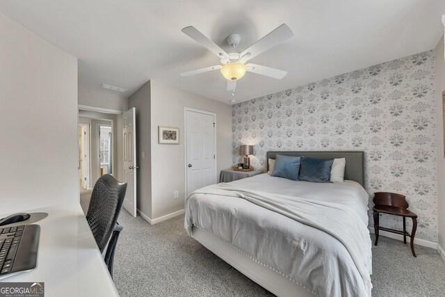213 Roseman Way, Woodstock, GA 30188 - bedroom with wallpapered walls, light colored carpet, baseboards, a ceiling fan, and an accent wall