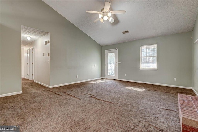 unfurnished living room featuring carpet floors, a ceiling fan, visible vents, and baseboards