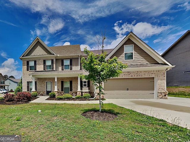 1820 Cobblefield Cir, Dacula, GA 30019 - craftsman-style house featuring driveway, a front yard, brick siding, and roof with shingles