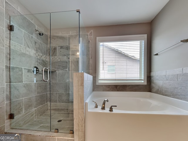 1820 Cobblefield Cir, Dacula, GA 30019 - bathroom with a garden tub and a stall shower